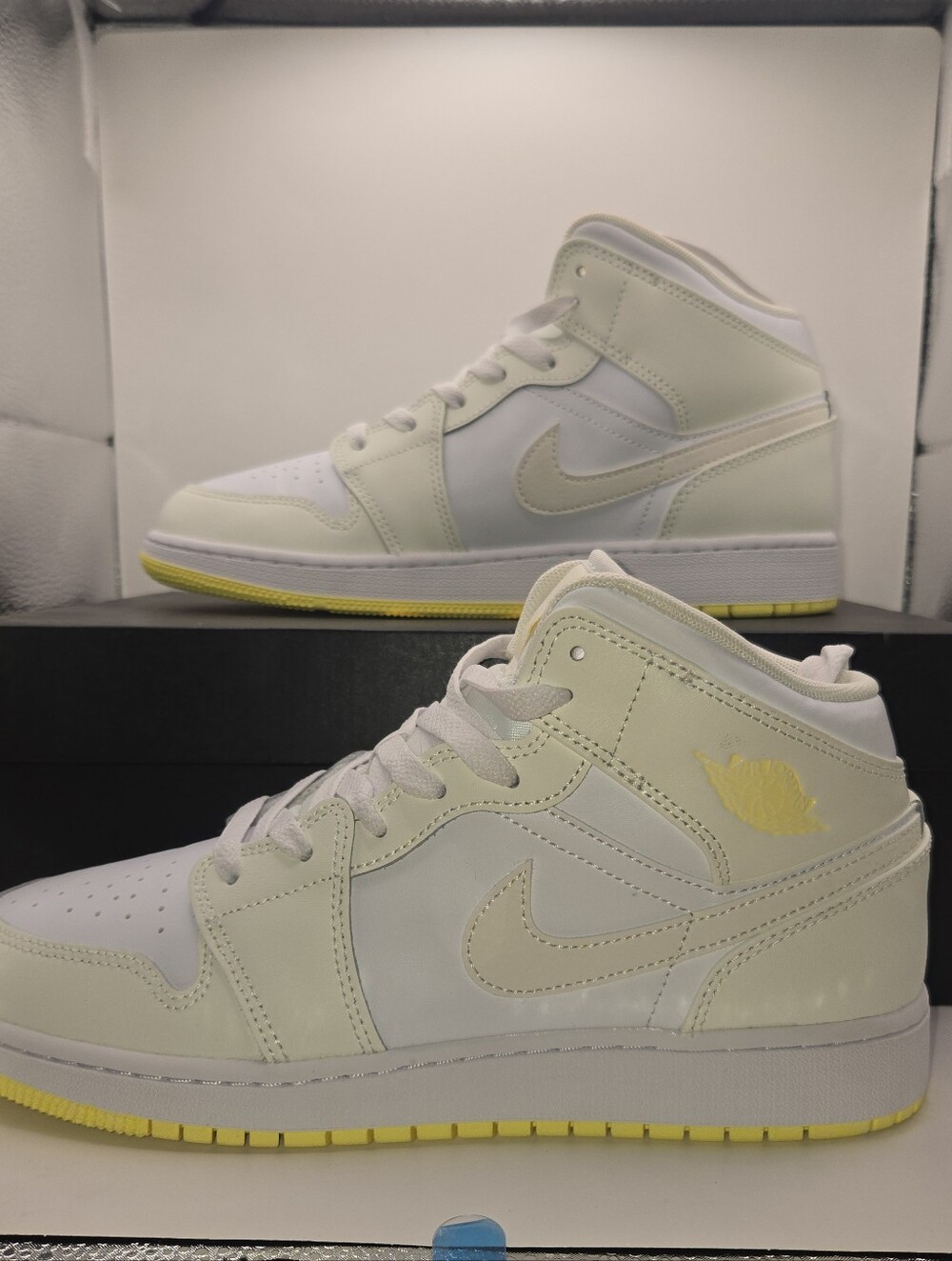 Air Jordan 1 Mid GS Sail Light Laser Orange sneaker. Youth 7